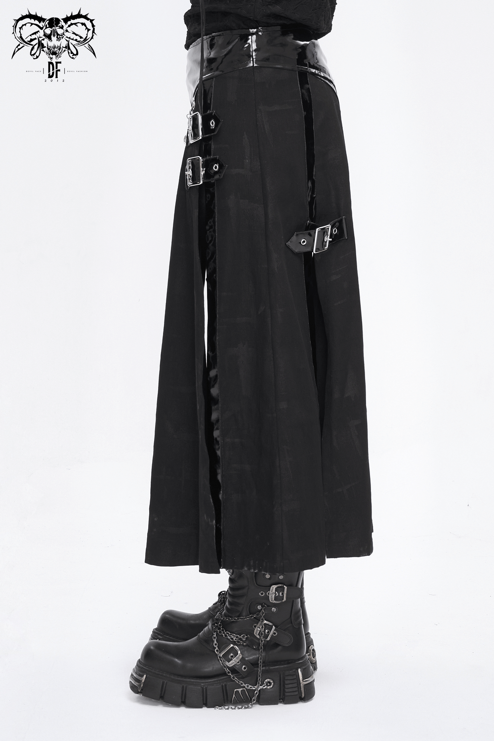 Men's Gothic faux leather kilt skirt featuring chains and buckles, styled with edgy black boots.