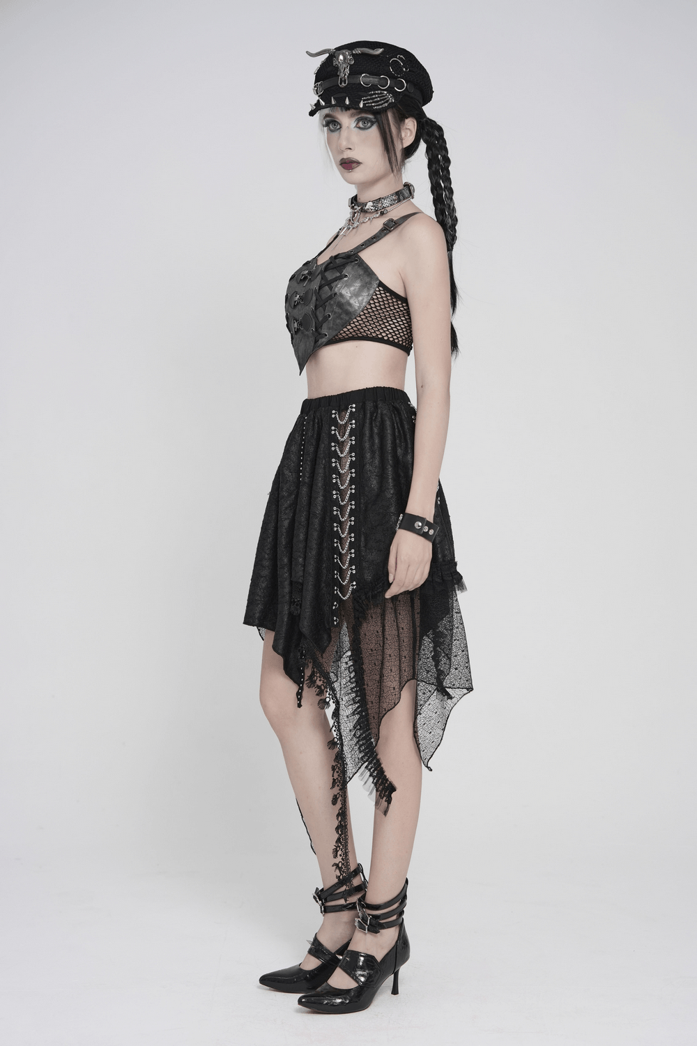 Gothic Faux Leather Lace Up Buckle Bralette Top styled with a black asymmetric skirt and edgy accessories.