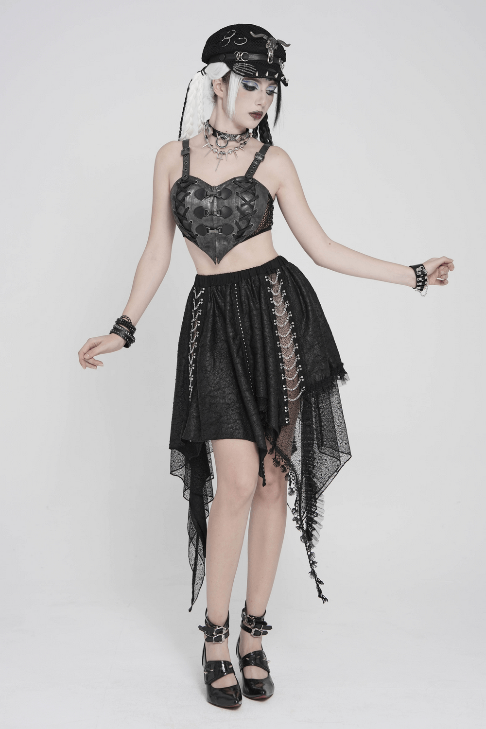 Gothic Faux Leather Lace Up Buckle Bralette Top paired with a sheer black skirt for a punk style outfit.