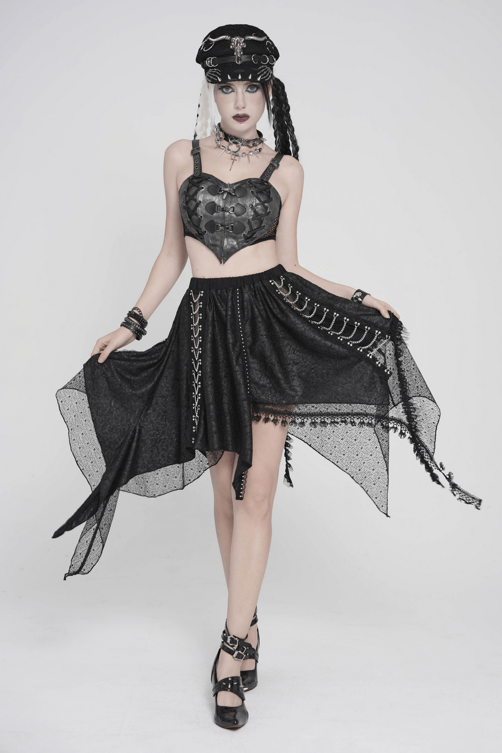 Model wearing Gothic Faux Leather Lace Up Buckle Bralette Top with skirt and accessories, showcasing a punk fashion statement.
