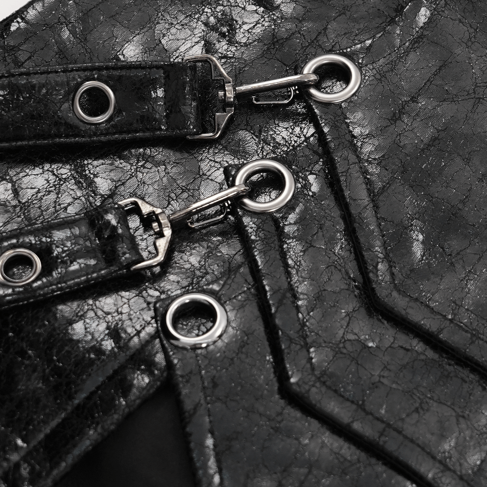 Close-up of gothic faux leather skirt straps and metal ring accents for a punk-inspired look.