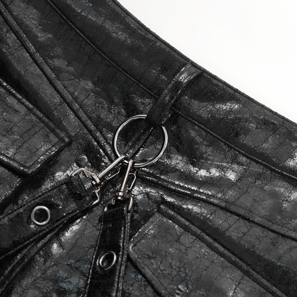 Close-up of gothic faux leather skirt showing metal ring and buckle details for a punk-inspired edgy look.