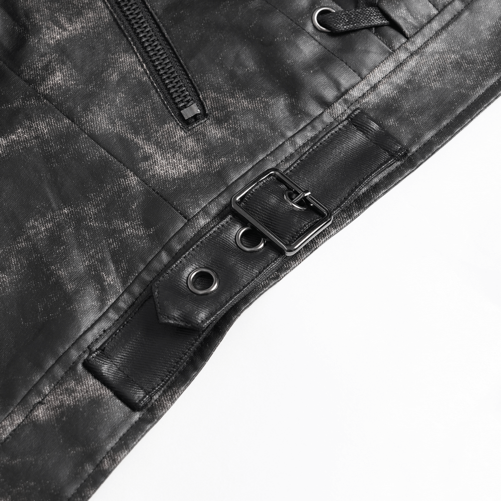 Close-up of gothic faux leather vest showing zipper, buckle, and lace-up details for punk rock style.