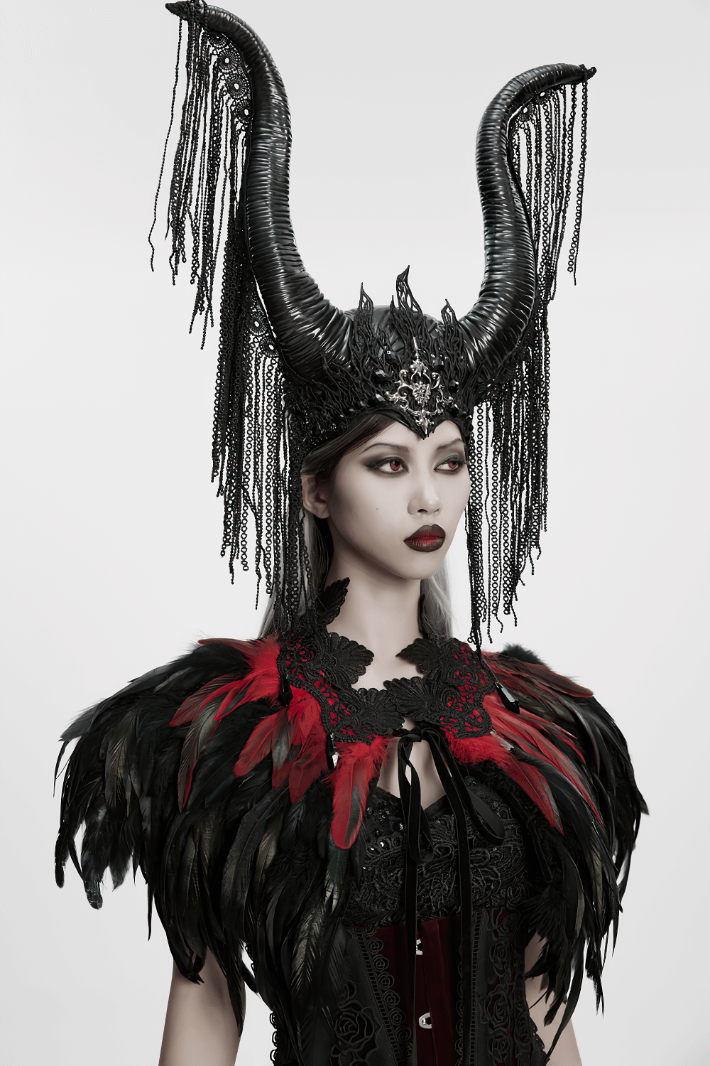 Gothic Feather and Lace Cape with Reversible Design showcased on a model with striking horns and dark elegance.