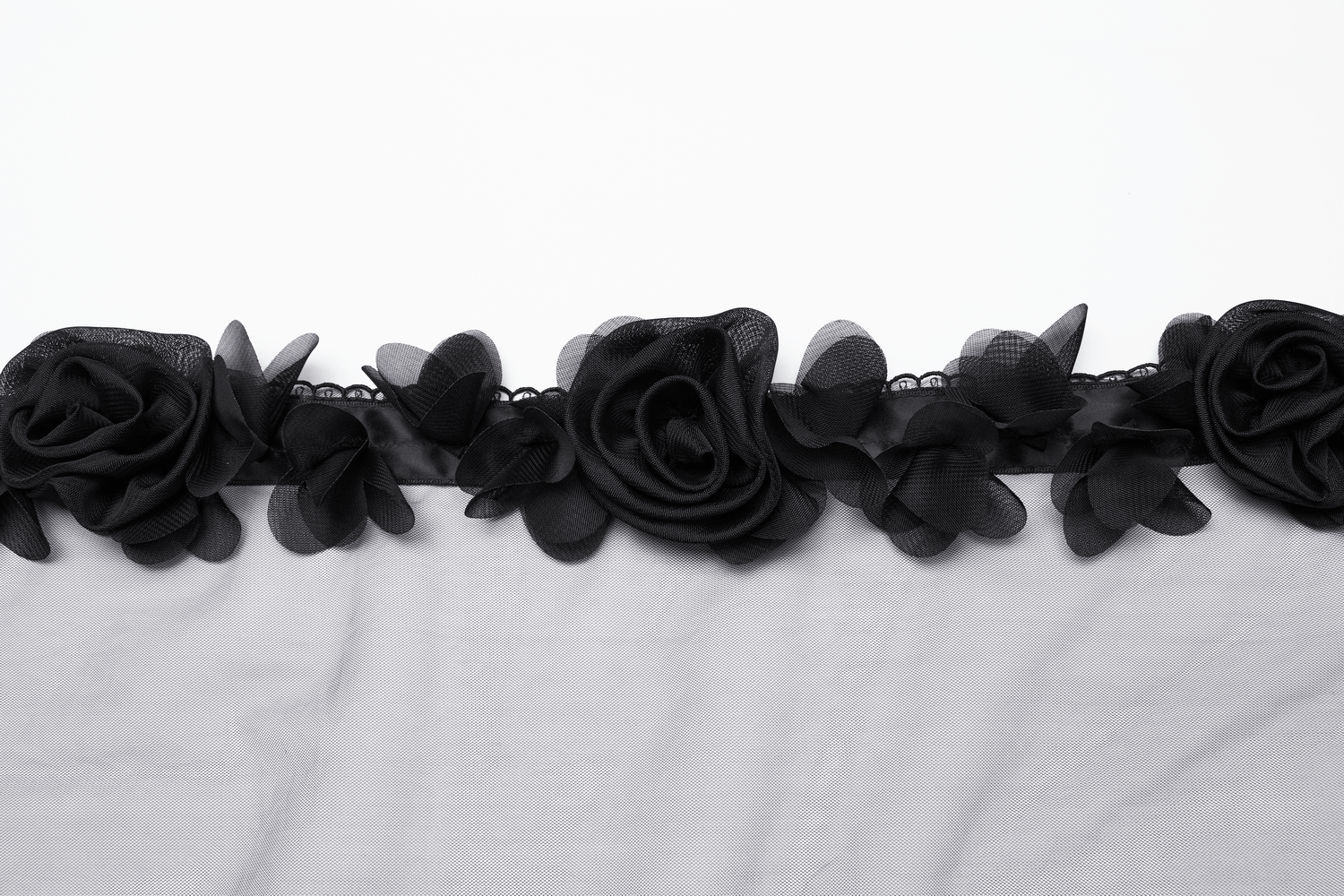 Close-up of black 3D roses on a lightweight mesh veil, showcasing elegant floral details and lace trim.