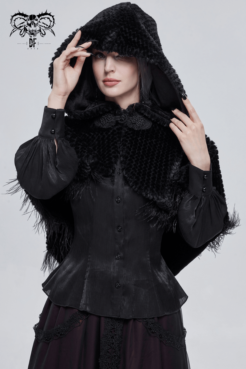 Stylish woman wearing a gothic black feathered hooded cape, featuring a vintage design and decorative fur balls.