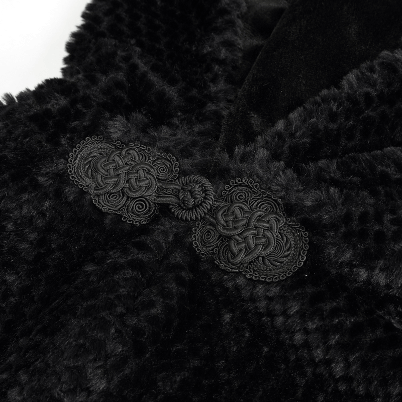 Close-up of intricate black buttons on a luxurious gothic style hooded cape.