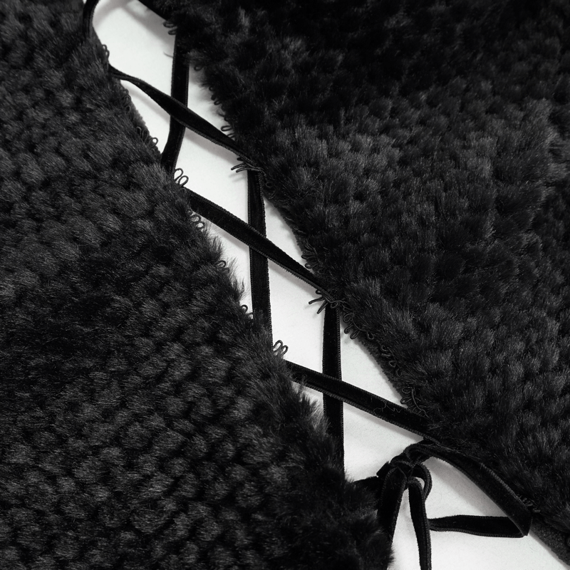Close-up of gothic black cape fabric with plush texture and lace-up details, perfect for a stylish gothic wardrobe.