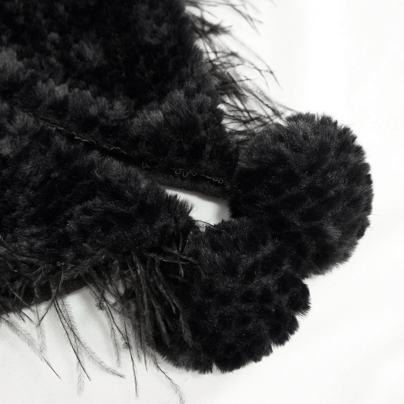 Close-up of a black gothic cape featuring plush fur balls and feather details, adding a stylish touch to your outfit.