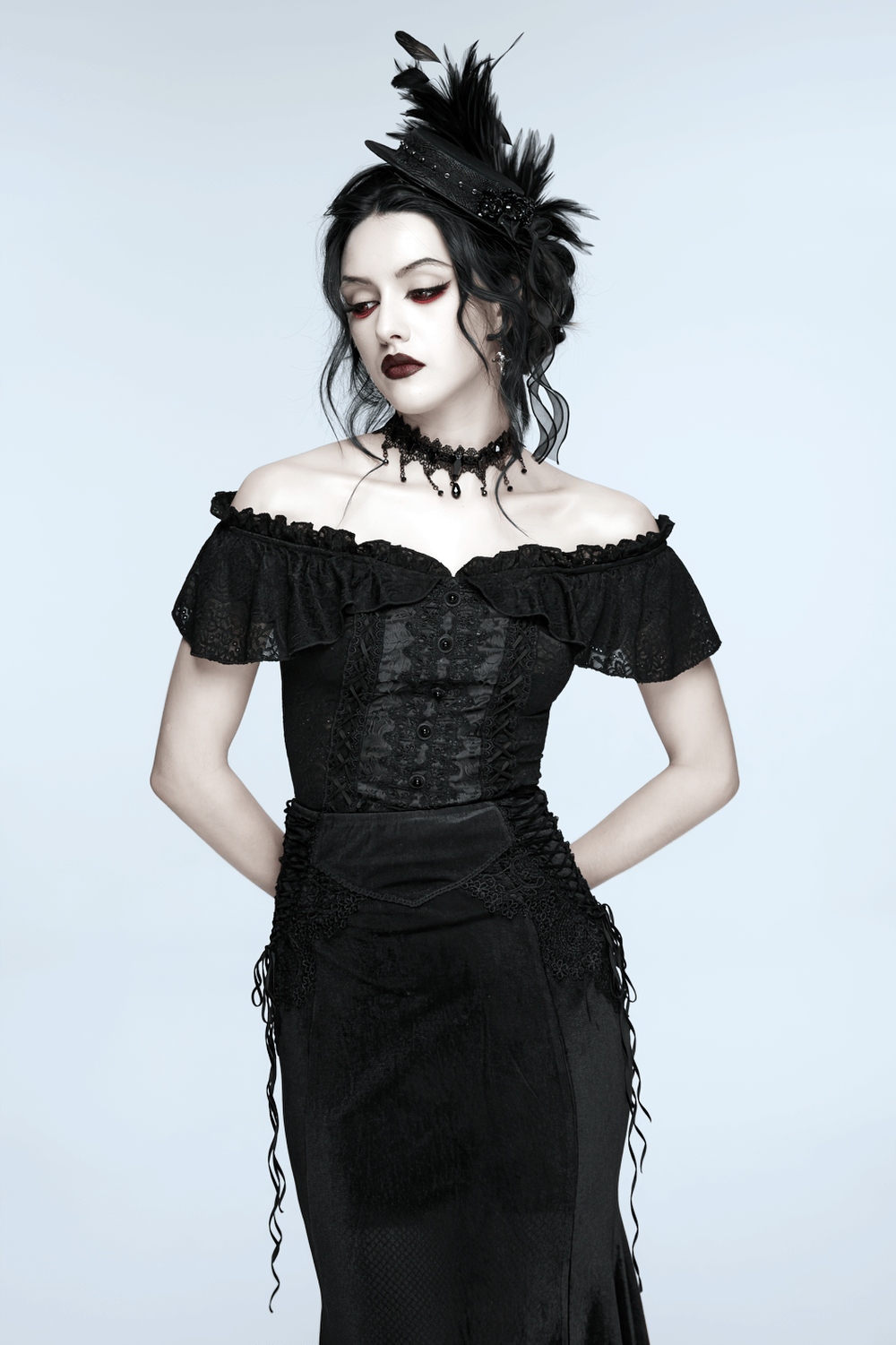 Gothic Feather Mini Hat with Ribbons and Vintage Flair worn elegantly with a black off-shoulder dress.