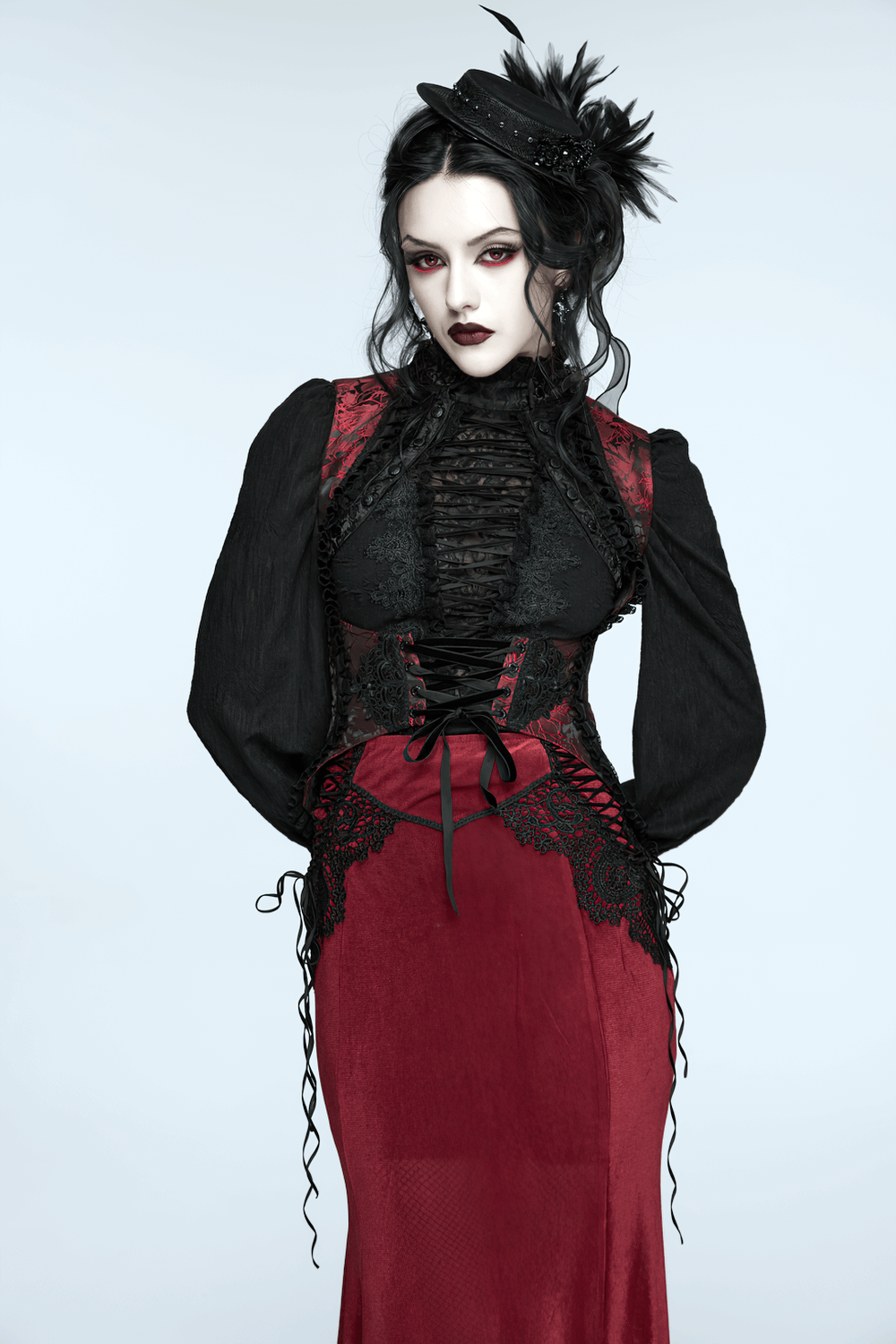 Gothic Feather Mini Hat with Ribbons and Vintage Flair worn by a model in a dark Victorian outfit.