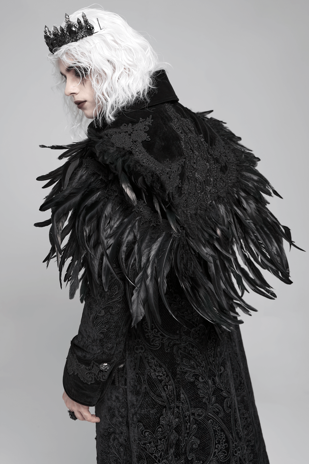 Gothic Feather Shoulder Cape with Lace and Chains worn by a model creating a dramatic, aristocratic style.