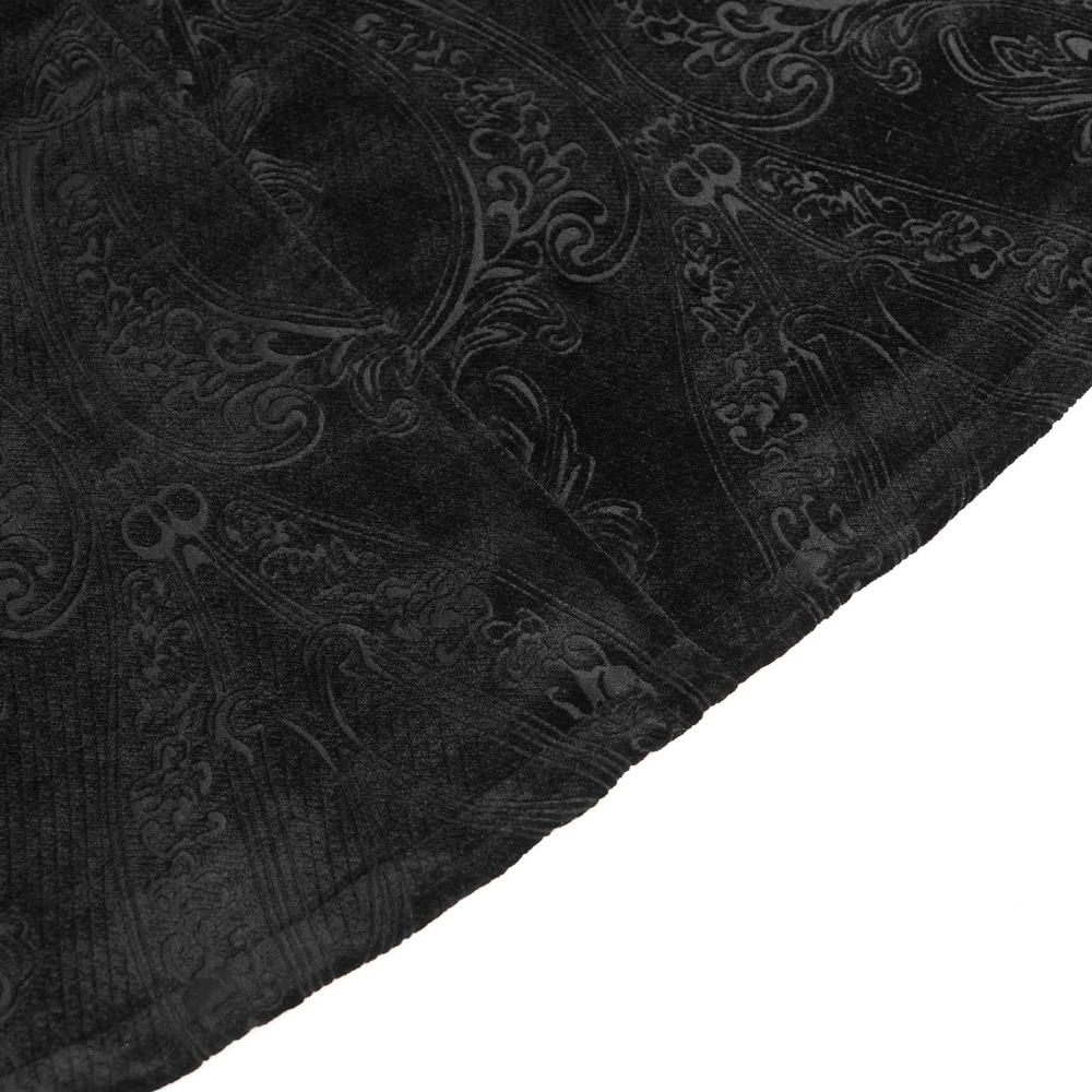 Gothic Feather Shoulder Cape with Lace and Chains textured black fabric close-up showcasing intricate patterns.