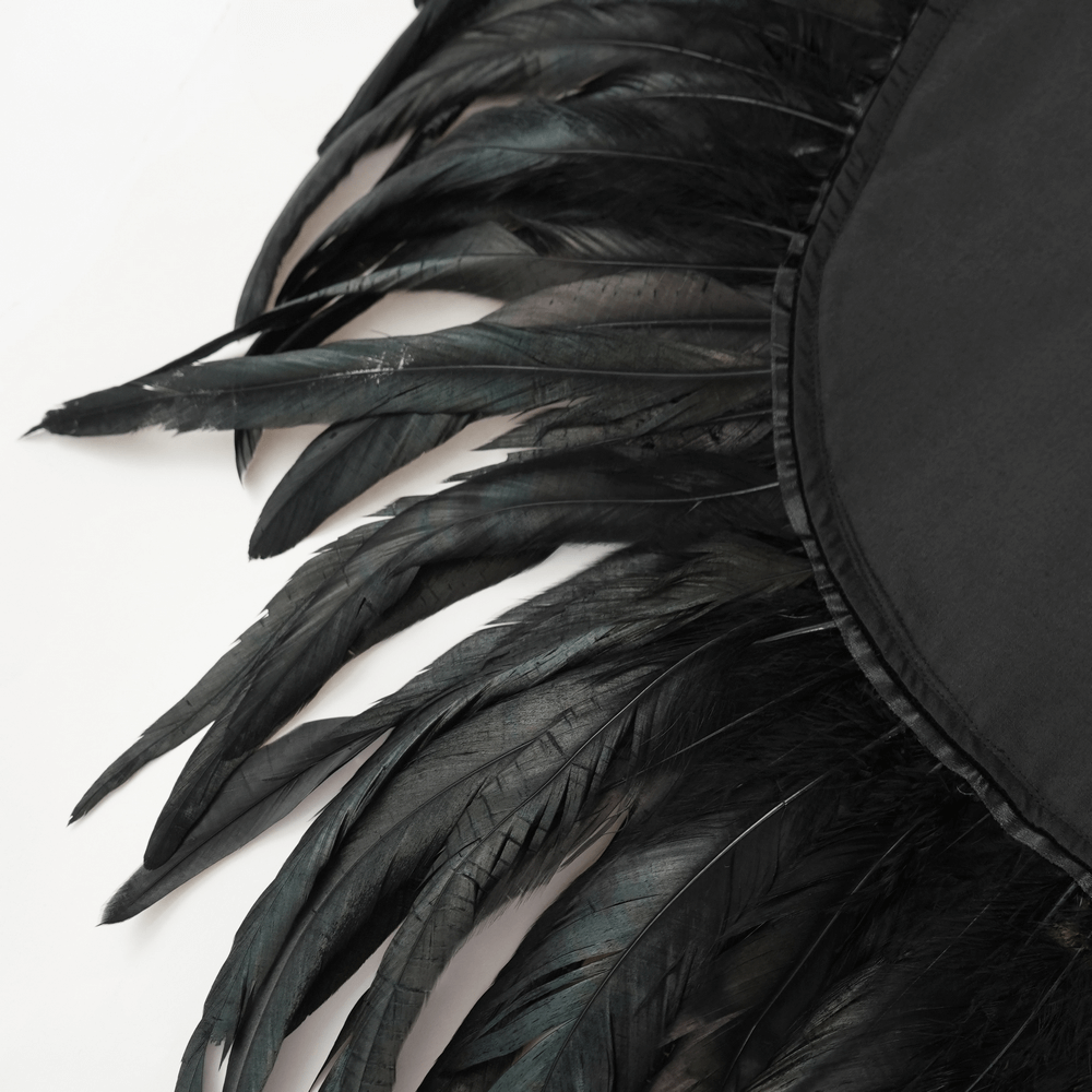 Gothic Feather Shoulder Cape with Lace and Chains showcasing layered black feathers on a draped fabric.