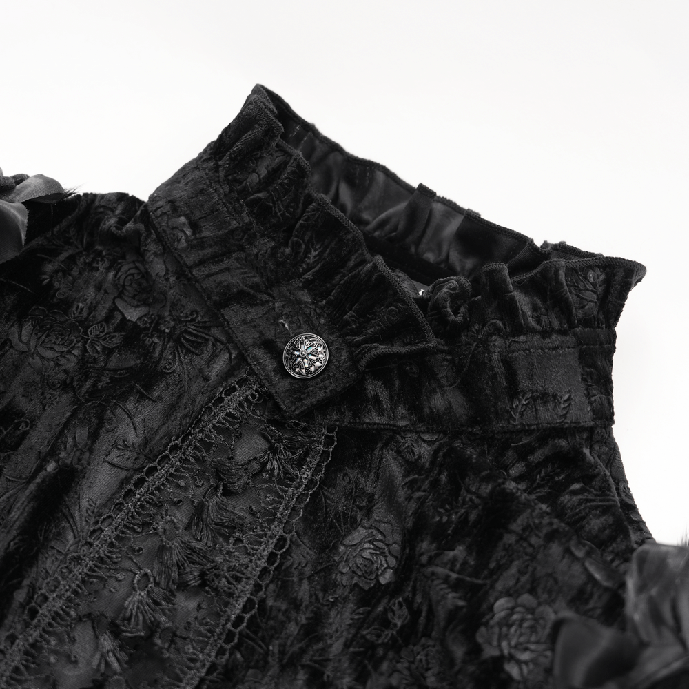 Close-up of a gothic velvet cape featuring intricate lace and floral detailing, perfect for dramatic fashion and Victorian elegance.