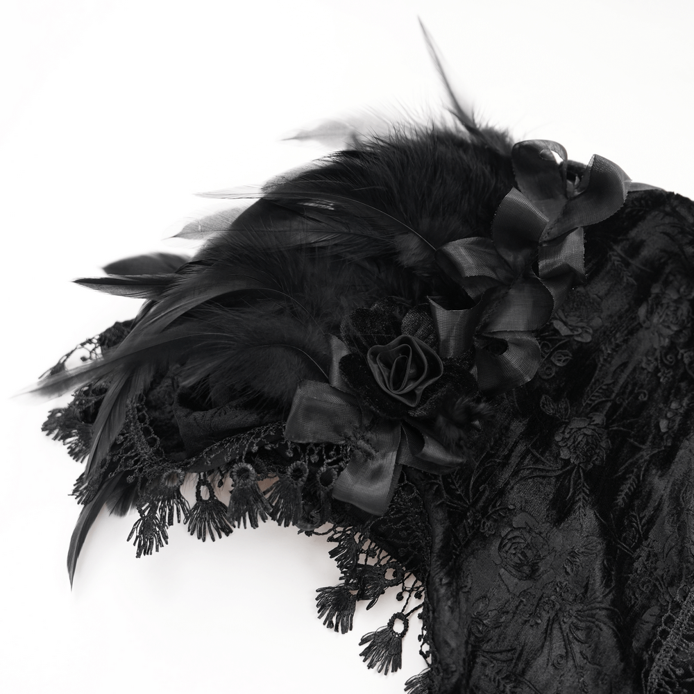 Close-up of a gothic black cape with feather accents, lace trims, and velvet roses for a dramatic Victorian look.