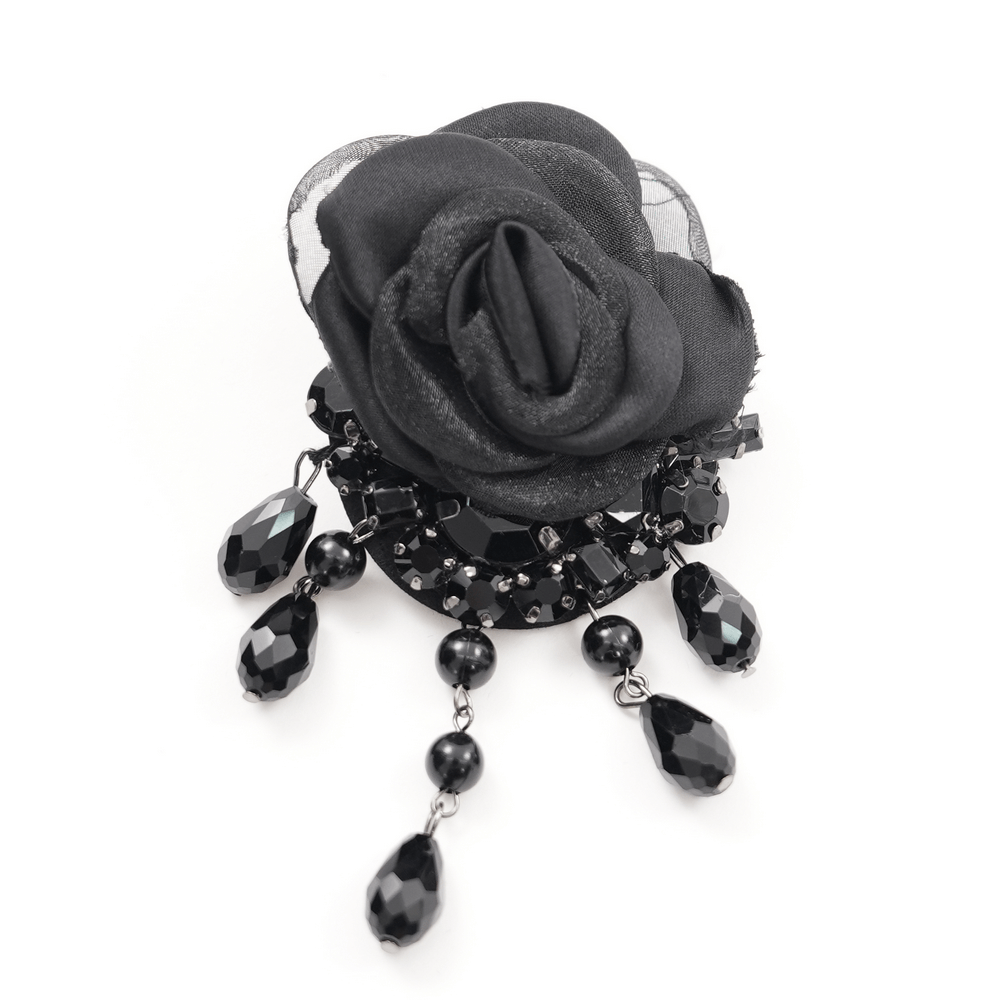 Elegant black brooch with a velvet rose and shimmering black beads, adding gothic charm to any outfit.