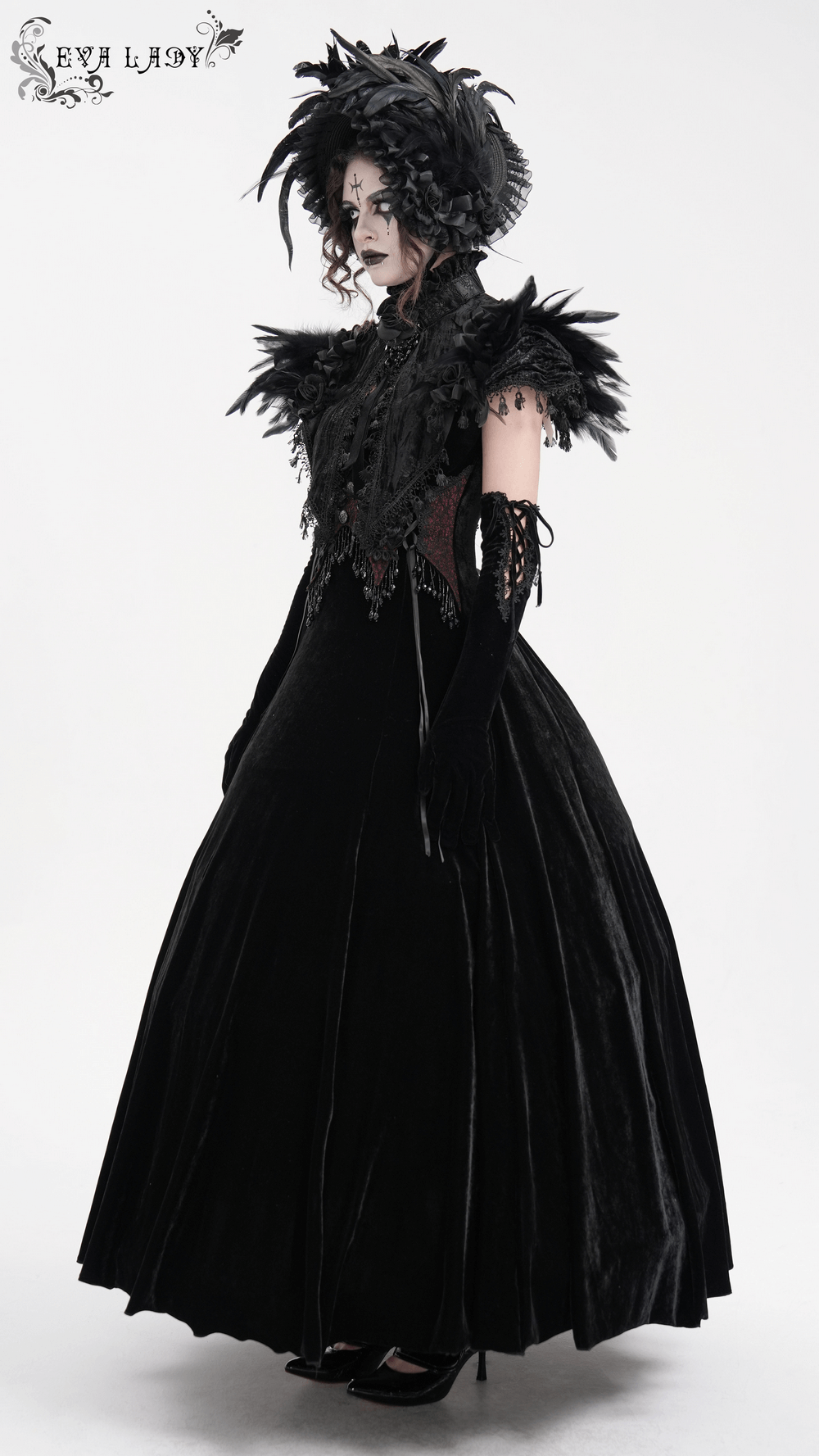 Dramatic gothic feathered cape with lace trims and velvet accents, perfect for Victorian-inspired fashion.