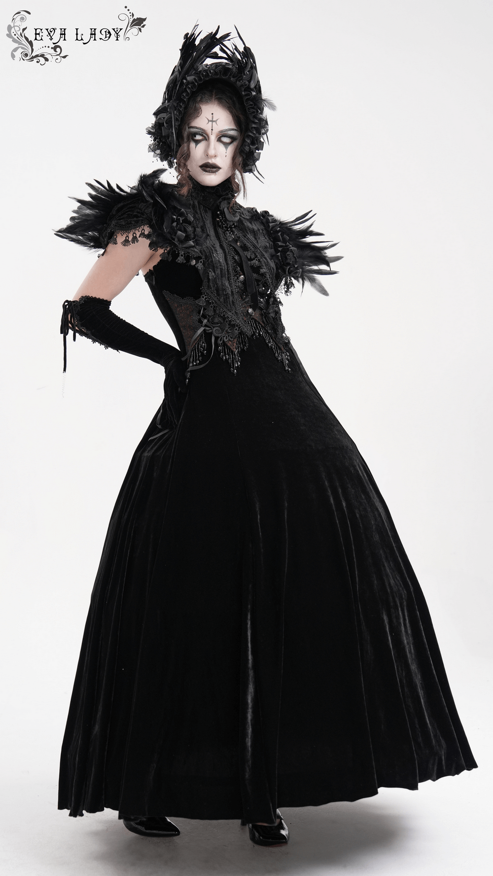 Dramatic black Gothic cape with feathered shoulders, lace trims, and Victorian-style elegance. Perfect for dark fashion.