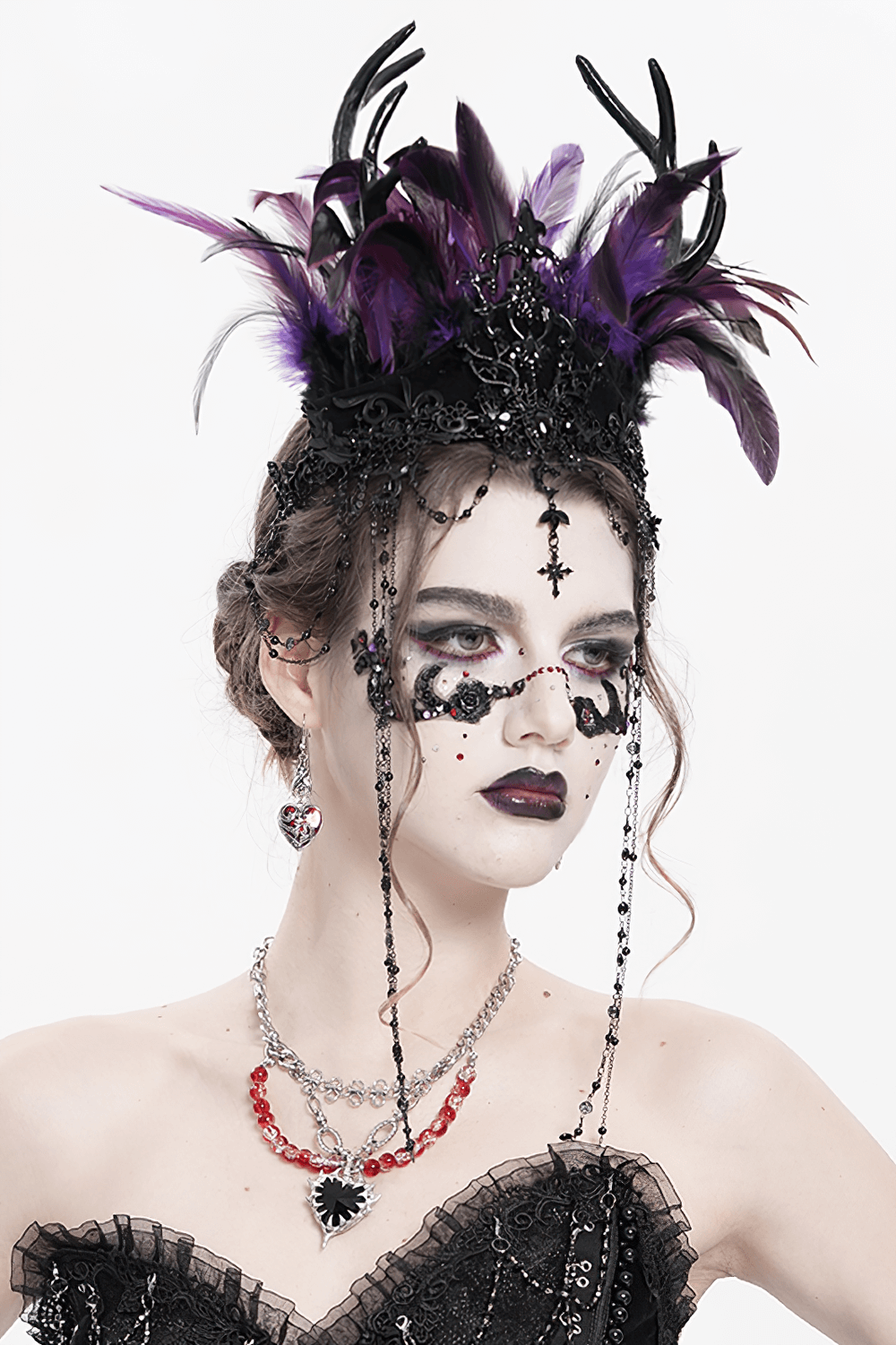 Gothic purple feathered crown with chains and cross ornaments for a darkly elegant look.