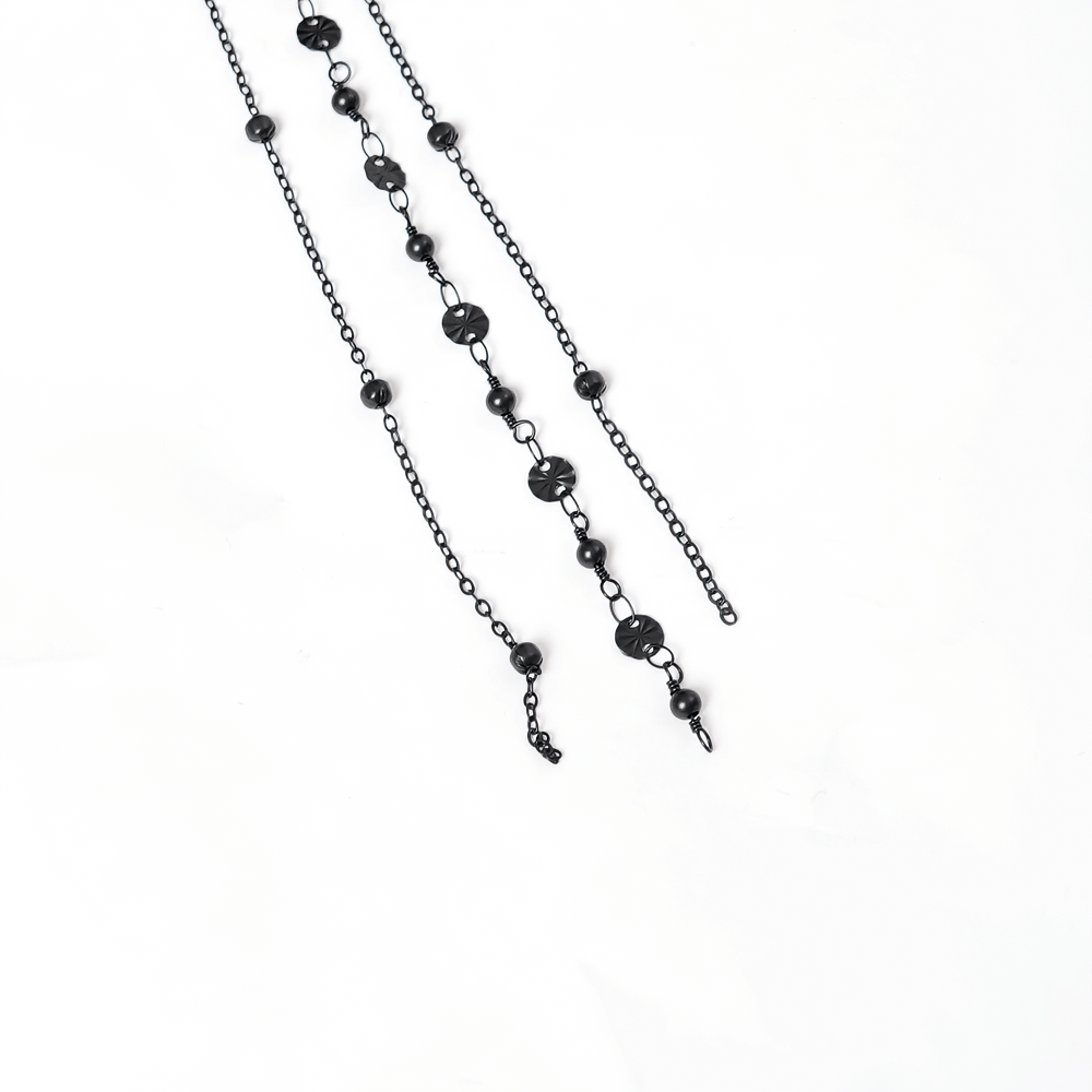Elegant black chain with decorative beads, perfect for adding a gothic touch to accessories.