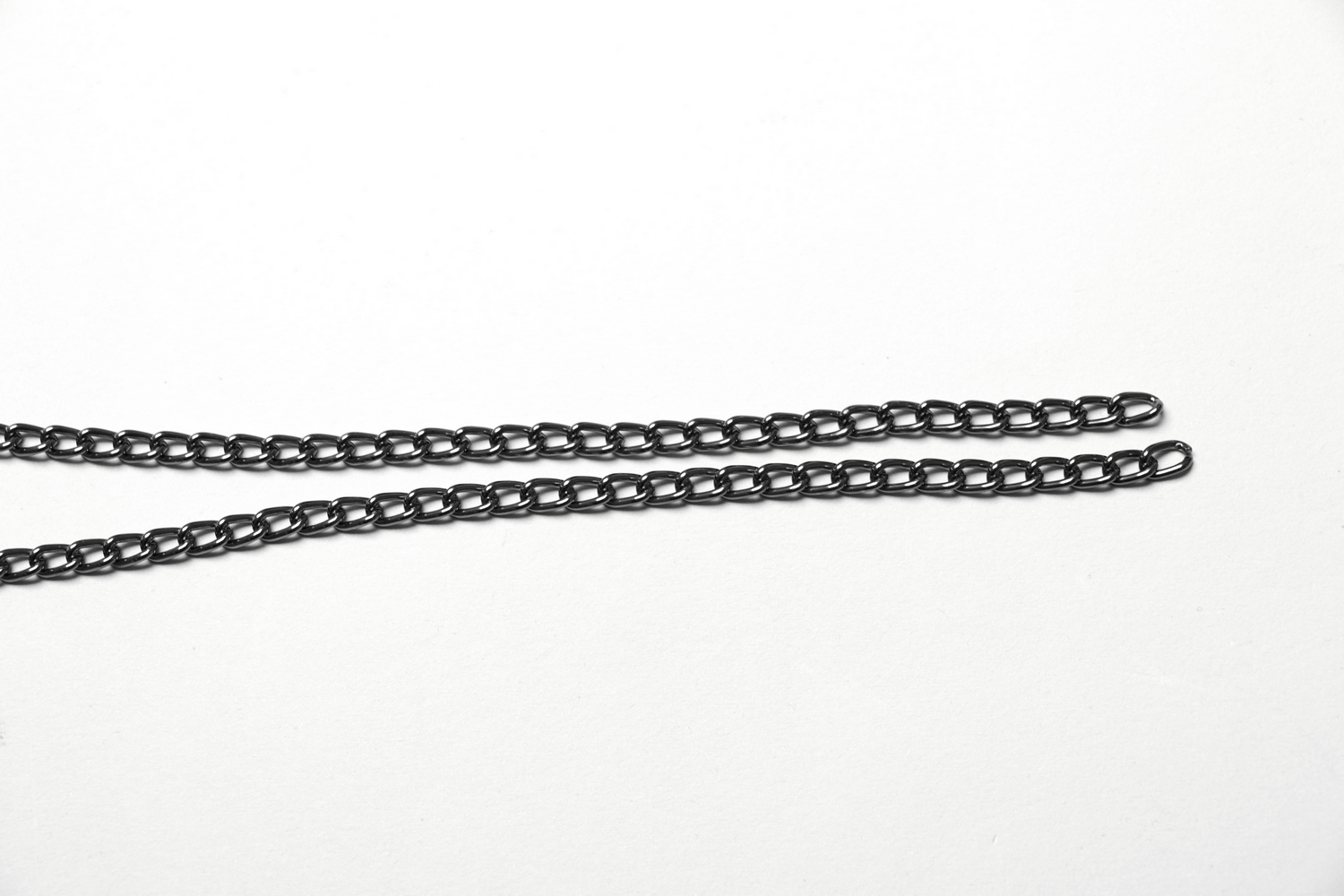 Stylish black chain links for edgy jewelry designs or accessories, showcasing a sleek and modern look.