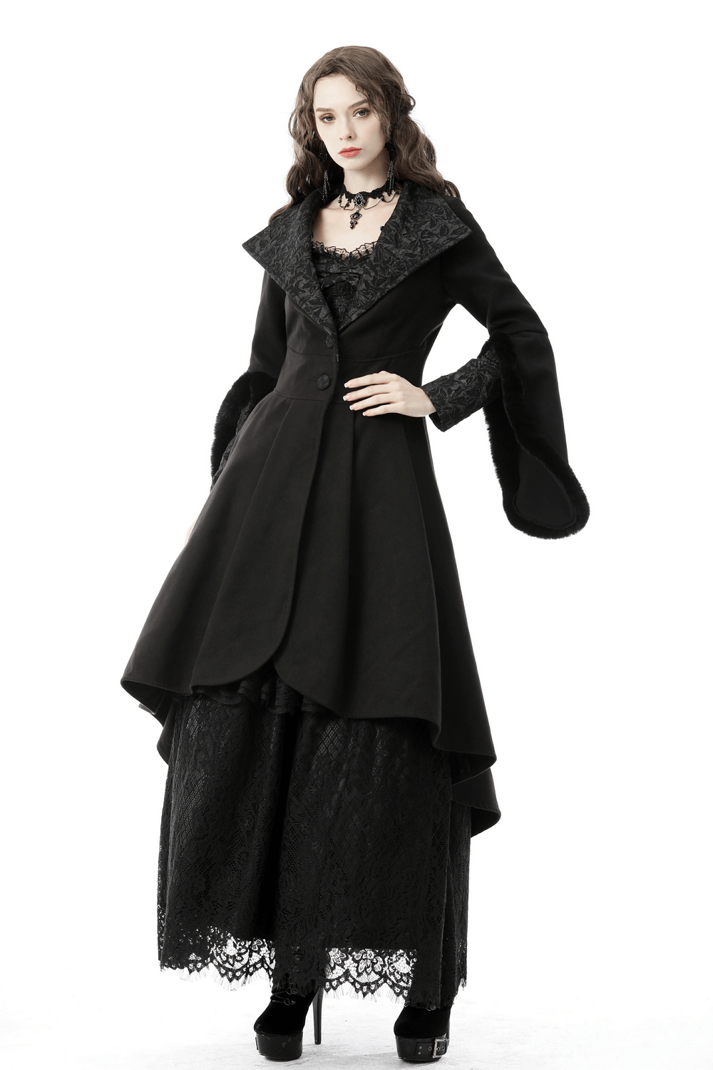 Gothic female model showcasing a stunning black hooded cocktail coat with flared sleeves and lace details.