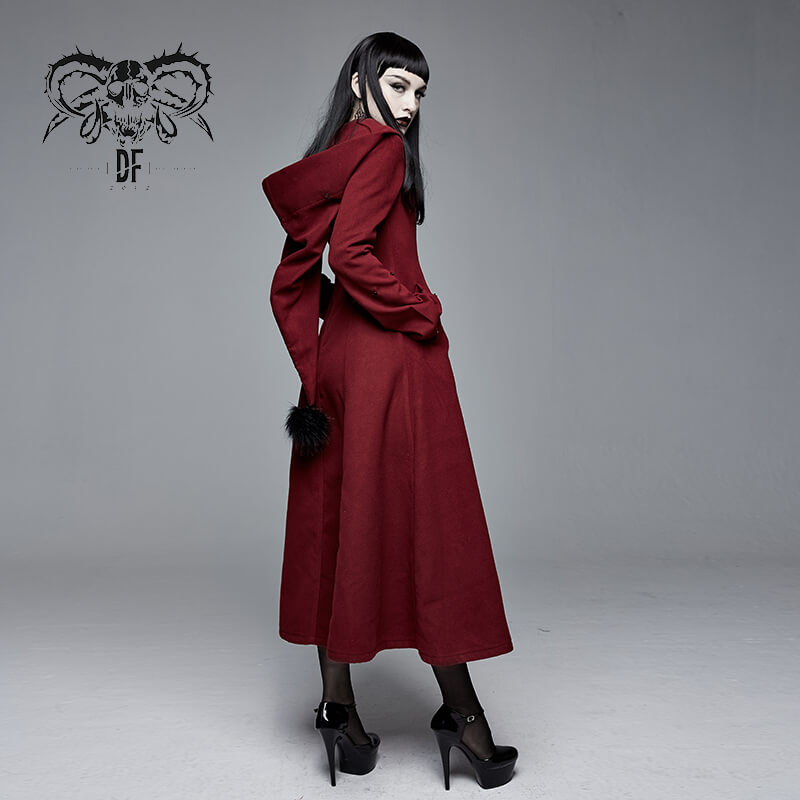 Gothic female model showcasing a long red coat with a fur collar and hood, perfect for alternative fashion looks.