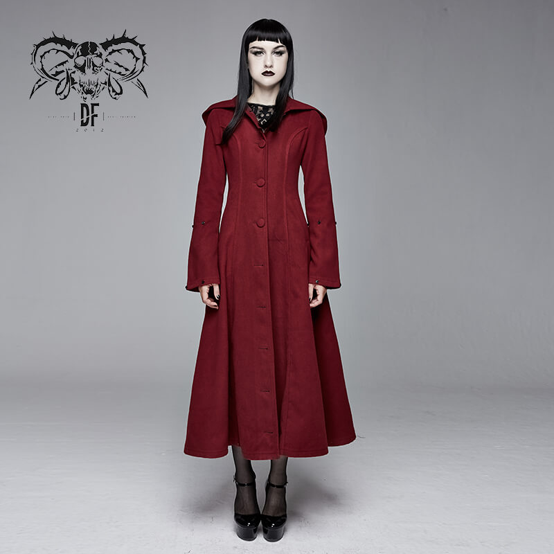Gothic female model in vintage red long coat with removable fur collar, showcasing alternative fashion style.