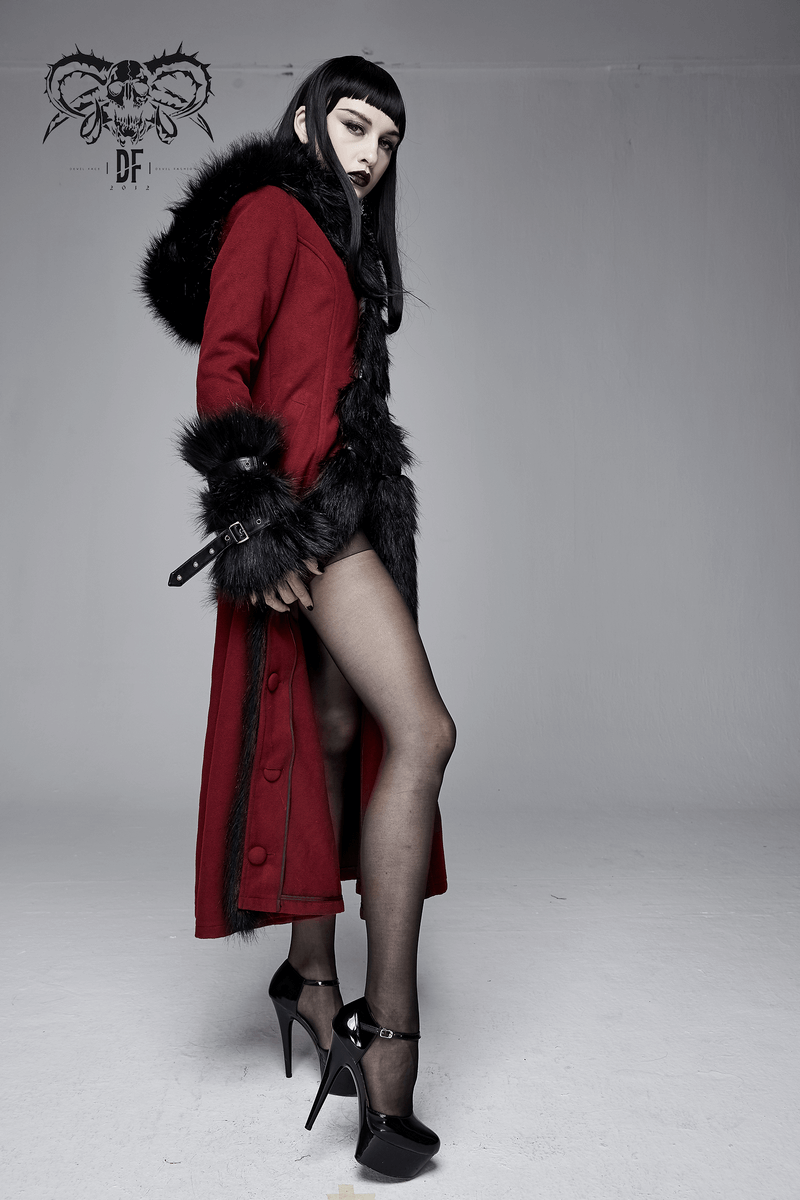Stylish woman in a red gothic long coat with removable fur collar, showcasing alternative fashion and vintage elegance.