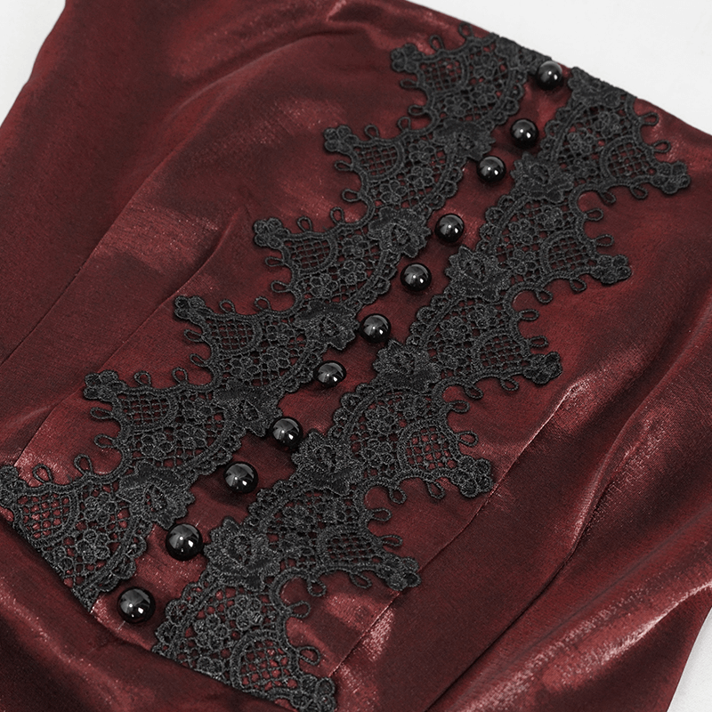 Close-up of wine red dress with intricate black lace and beads, showcasing gothic elegance and vintage charm.
