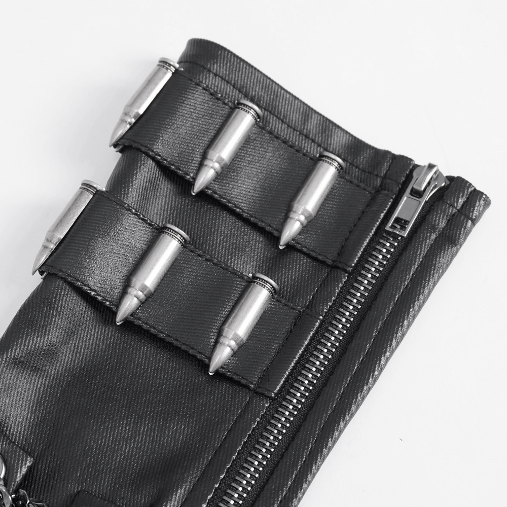 Close-up of gothic fingerless gloves with zipper, featuring silver chain and bullet details for an edgy look.