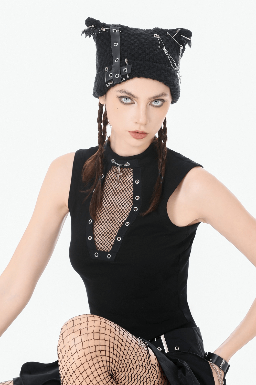 Gothic Fishnet Cutout Sleeveless Mock Neck Top featuring bold fishnet details and metal grommets for a punk look.