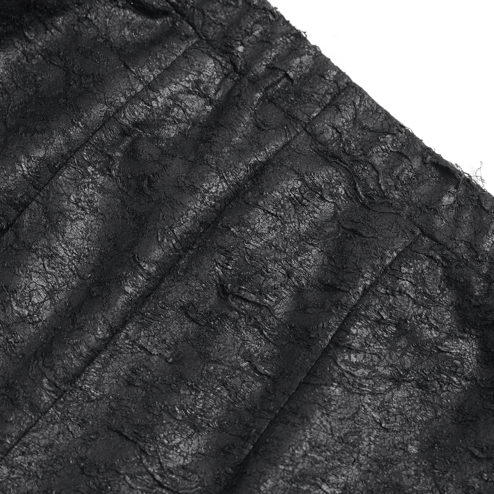 Close-up of the textured fabric of Gothic Fishnet Lace Up Flare Pants with Chains, showcasing the intricate details.