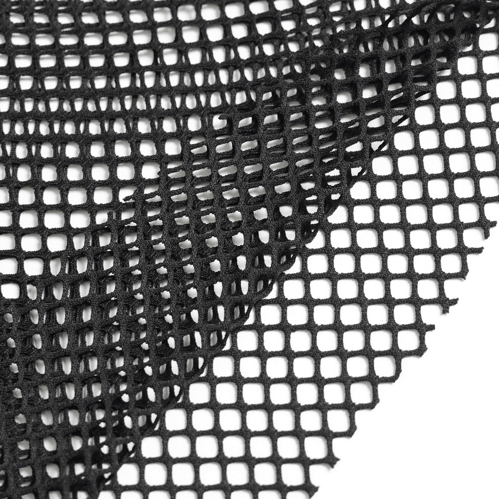 Gothic Fishnet Lace Up Flare Pants with Chains close-up of black net fabric showcasing its unique texture.