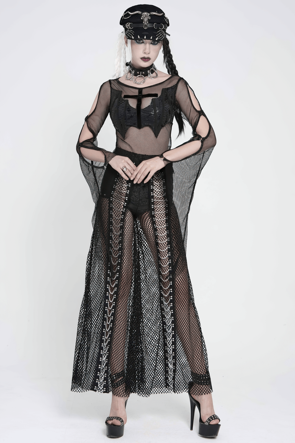 Gothic Fishnet Lace Up Flare Pants with Chains worn with a black sheer top and accessories for a punk look.