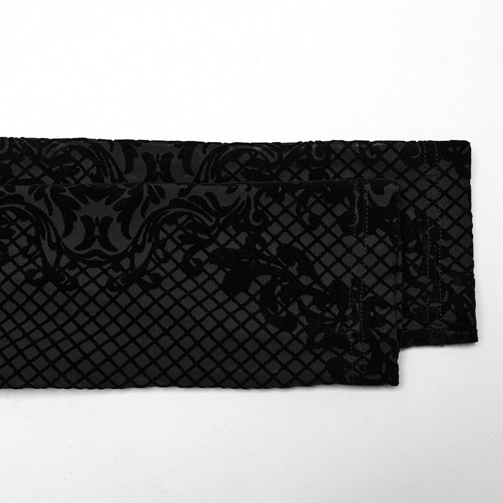 Gothic flocked mesh fabric showcasing intricate Victorian-inspired patterns on a black background.