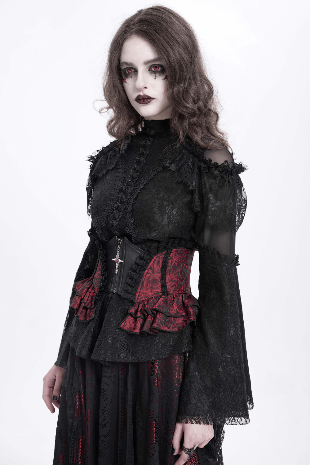 Gothic model in a lace ruffle top and floral waist corset with intricate detailing and dark, dramatic makeup.