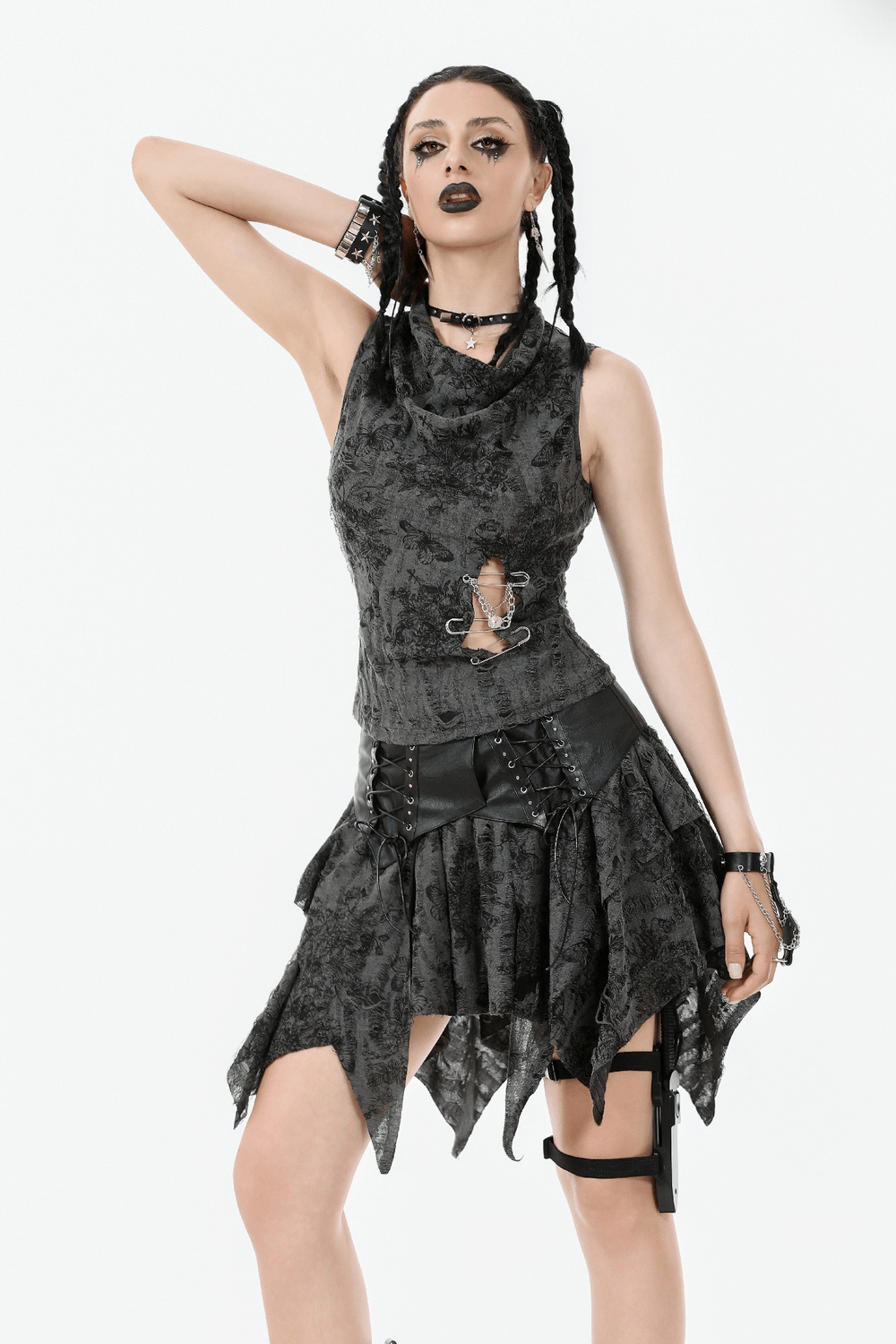 Model showcasing a Gothic floral sleeveless top with chains and pins, styled with edgy accessories.