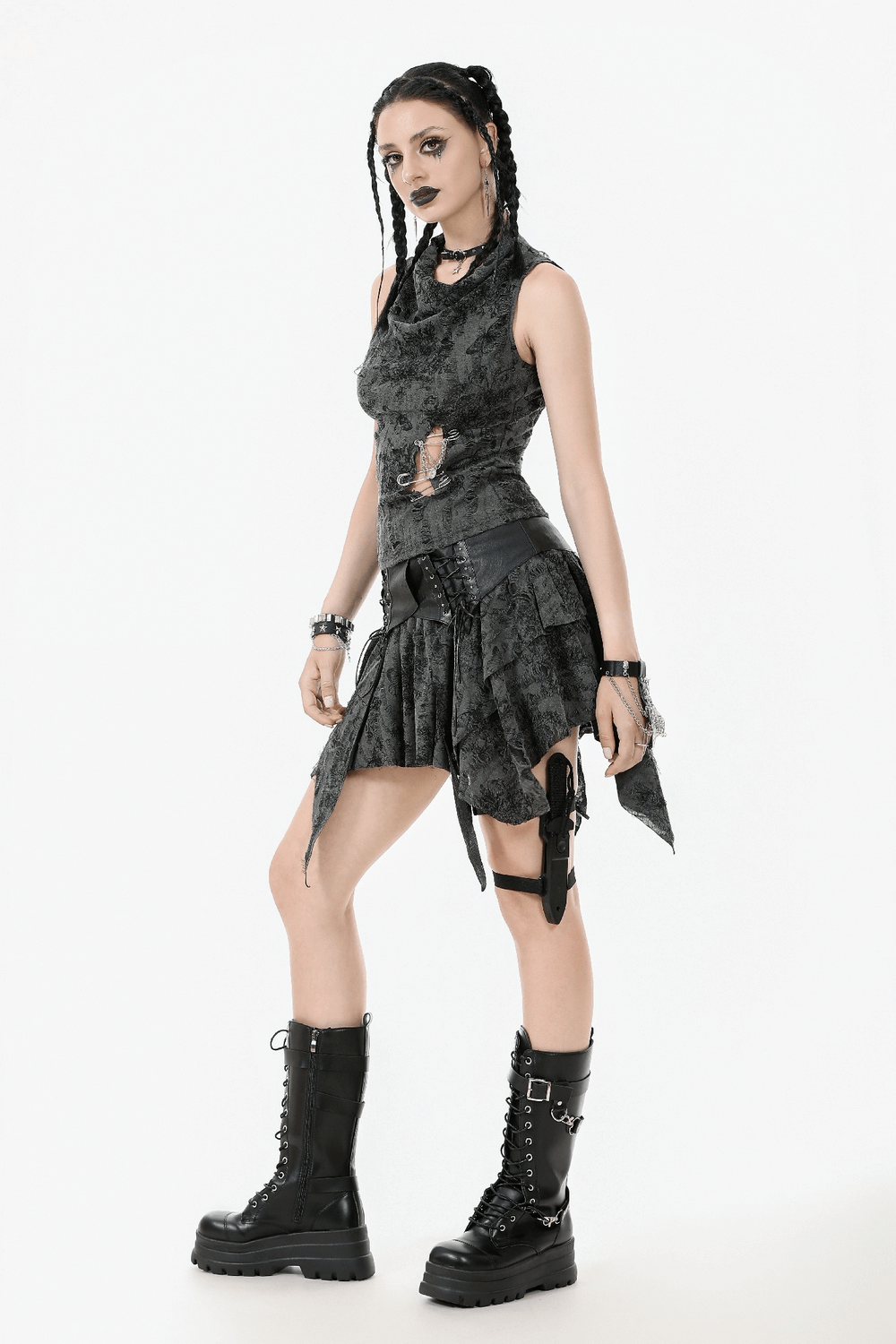 Gothic floral butterfly sleeveless top with chains and pins styled with a unique black skirt and chunky boots.