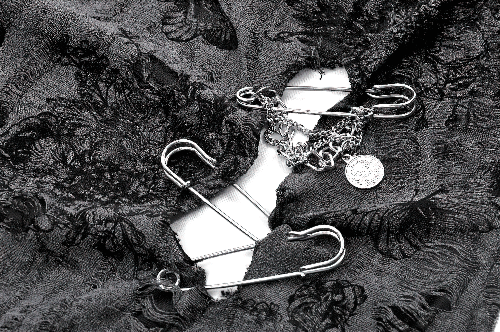 Gothic floral fabric featuring silver chains and safety pins, perfect for an edgy butterfly sleeveless top.