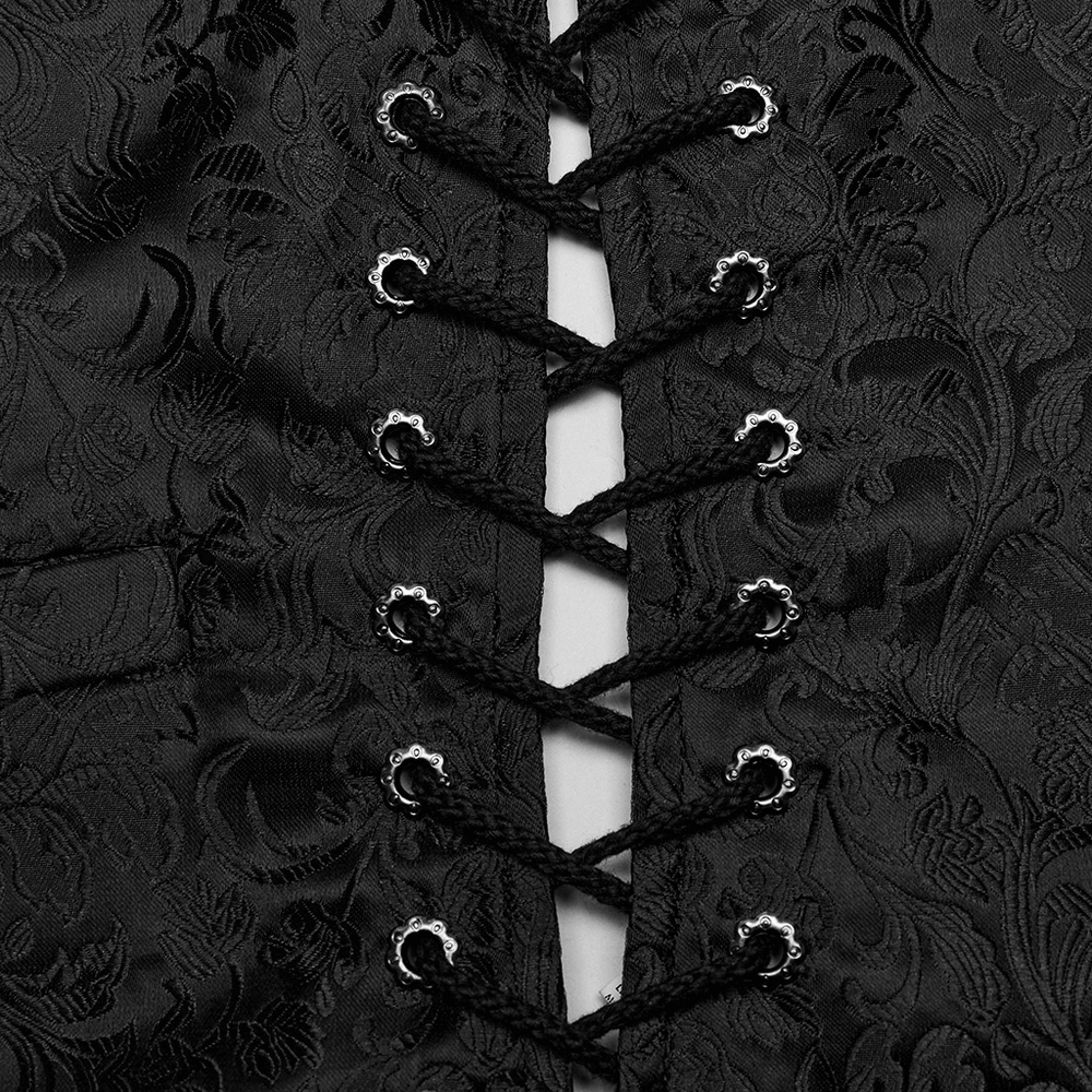 Close-up of gothic floral jacquard fabric with eyelet drawstring lacing on a stylish waistcoat.