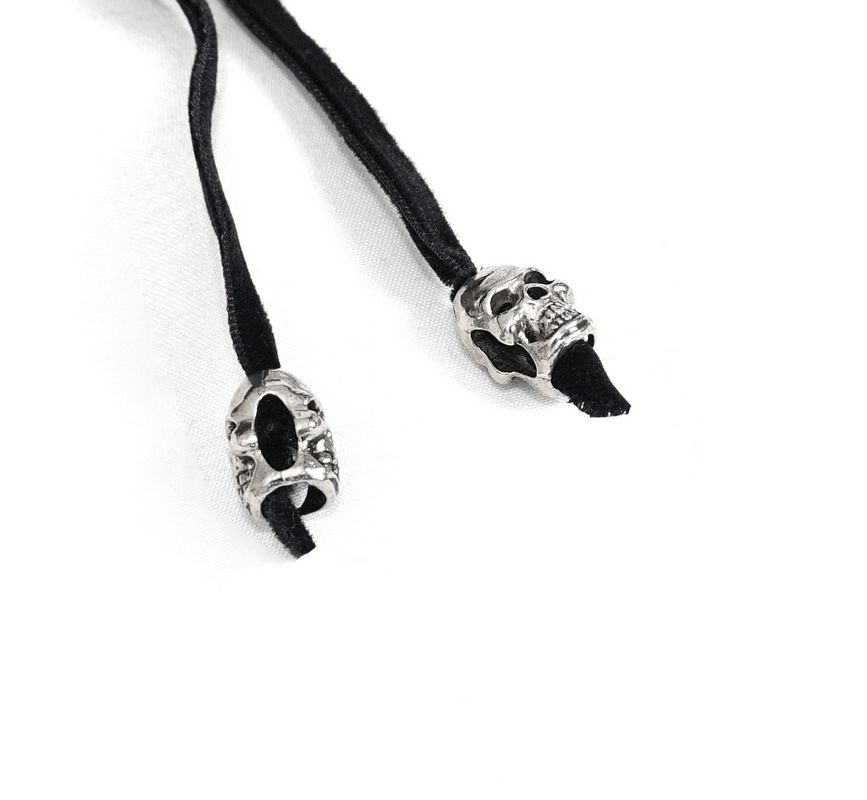 Skull accent black drawstrings for gothic style clothing or accessories, adding a touch of edgy elegance.