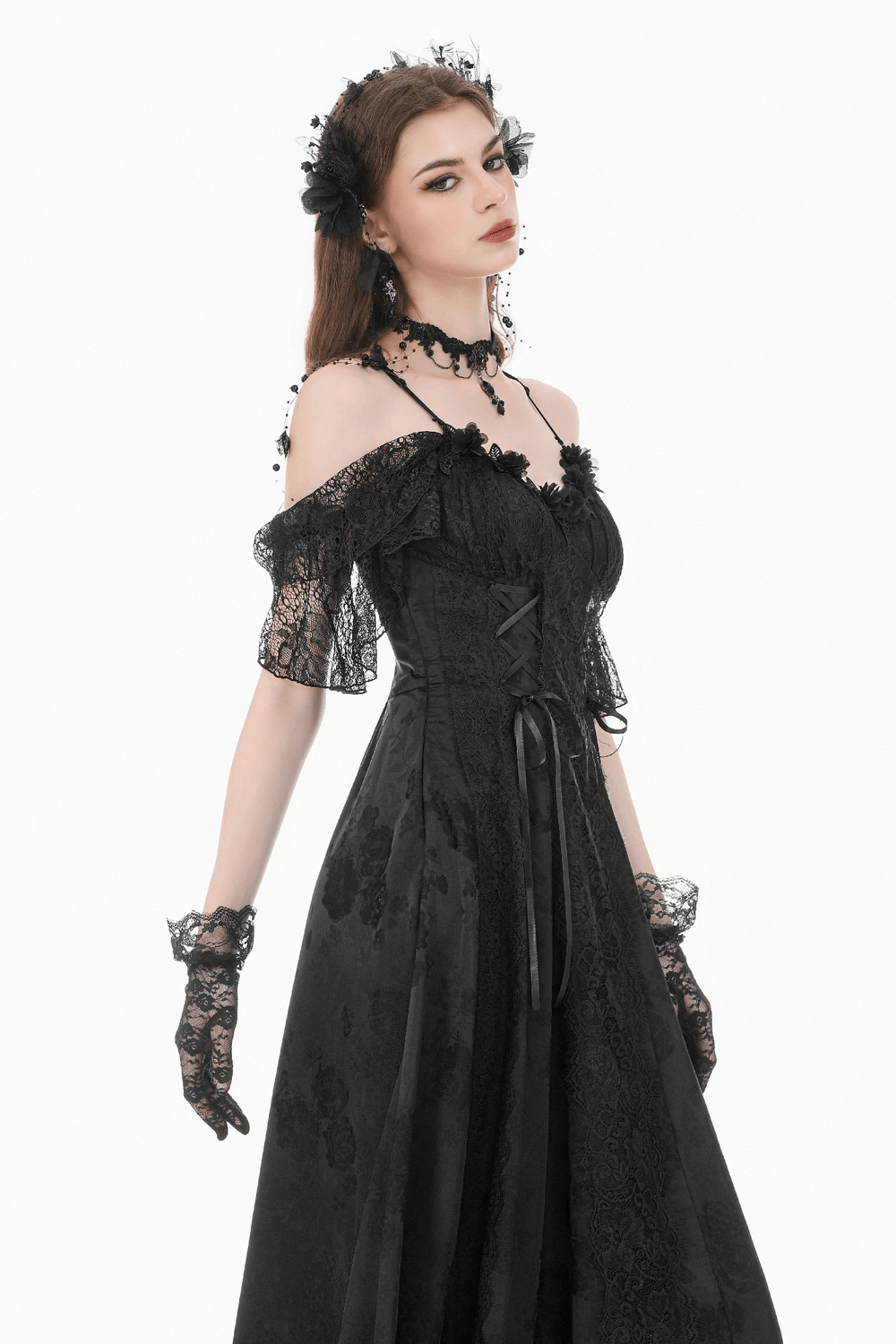 Gothic Floral Maxi Dress with Lace Sleeves and Corset Trim worn by a model, showcasing off shoulder design and intricate lace details.