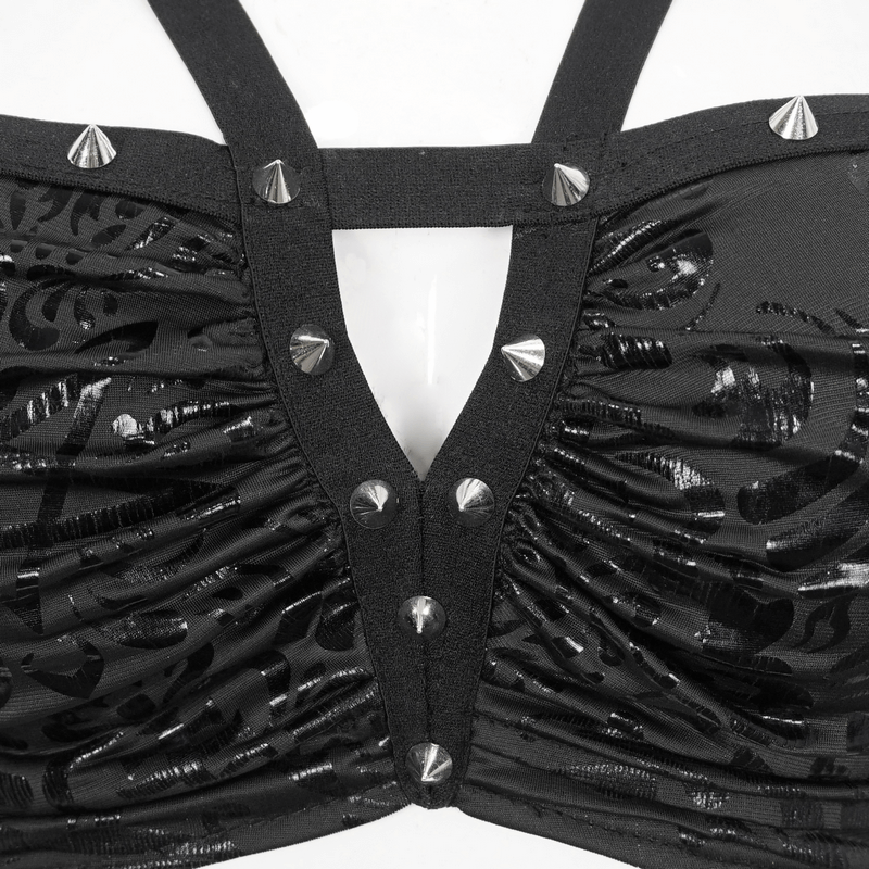 Close-up of gothic floral print swimsuit with studded details and star-shaped straps in black.