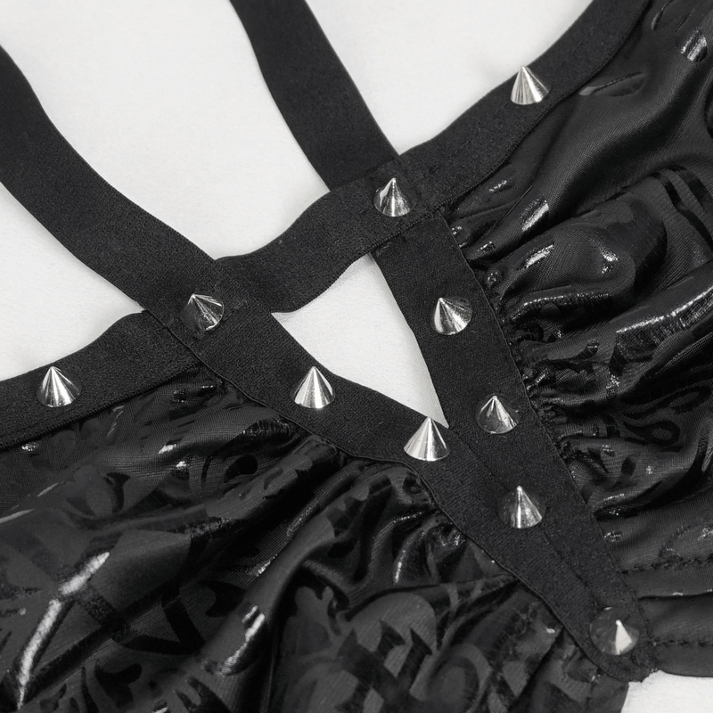 Close-up of goth swimsuit straps with studs and floral pattern for edgy swimwear style.