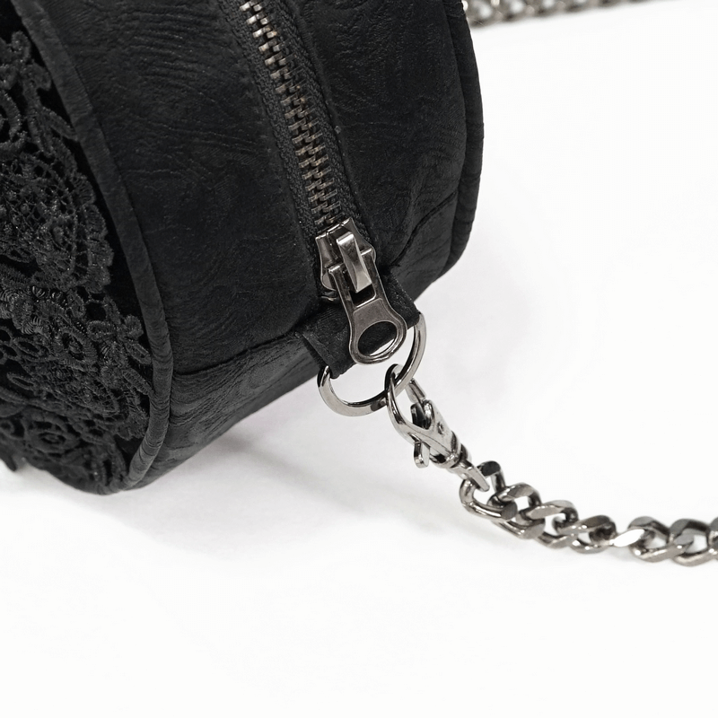 Close-up of gothic floral round bag with guipure inserts and silver zipper detail, perfect for an elegant gothic look.