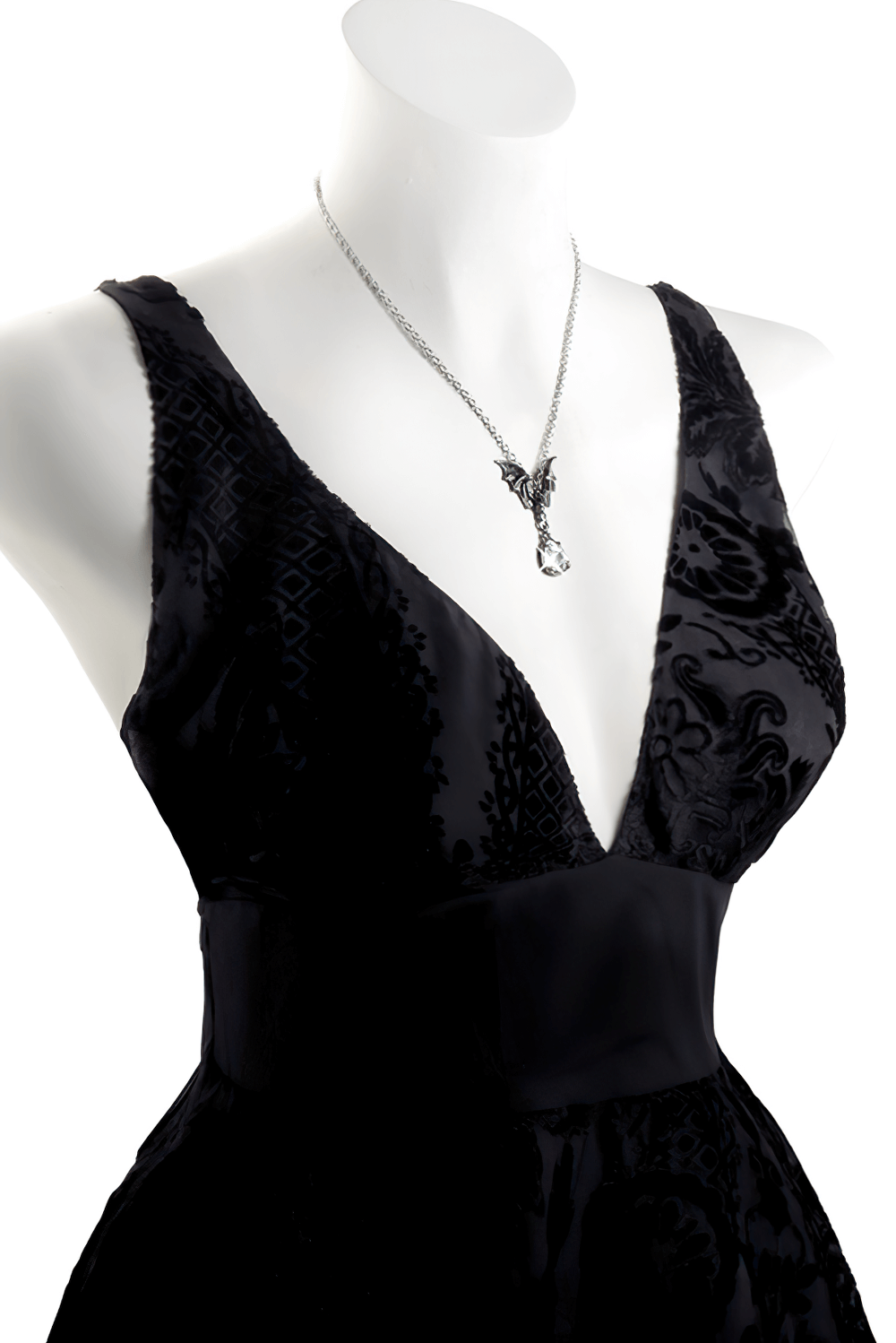 Elegant black dress featuring a gothic bat pendant necklace with a crystal drop.