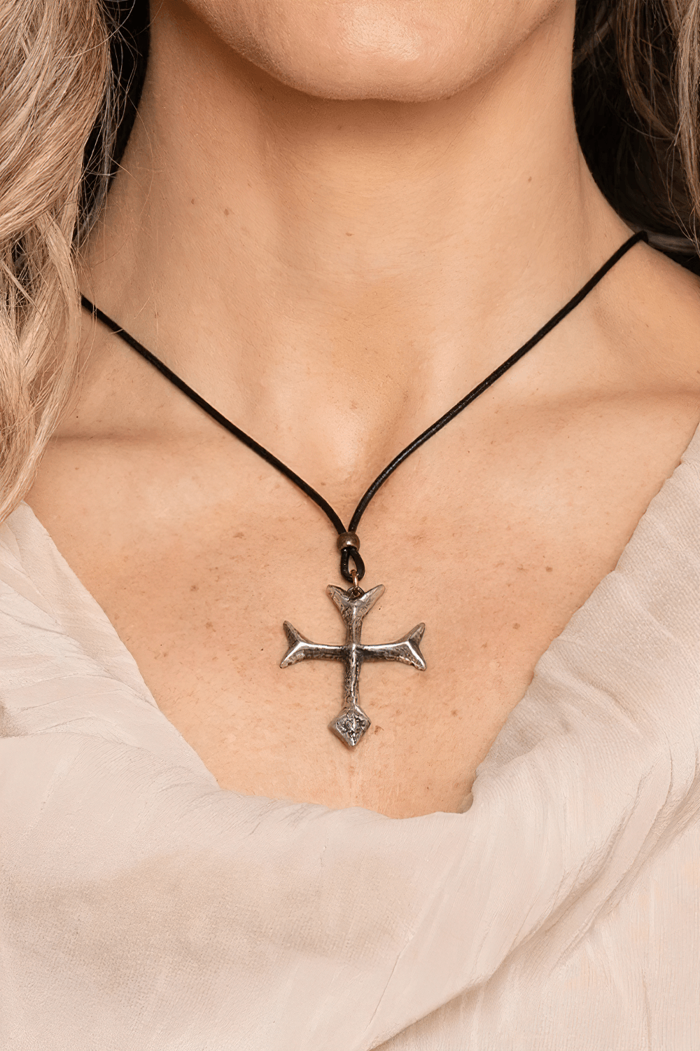 Gothic Fourchee Cross Pewter Pendant Necklace worn on a black cord, showcasing a medieval-inspired design.