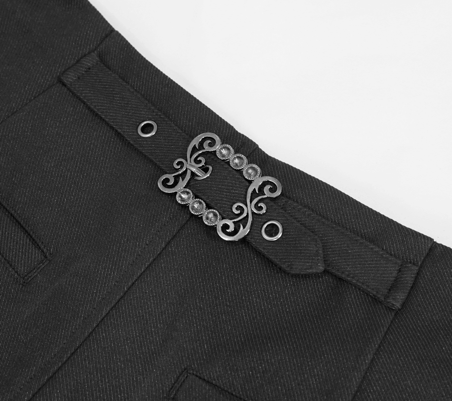 Close-up of gothic black pants with decorative waist buckle and lace detail, showcasing stylish design features.